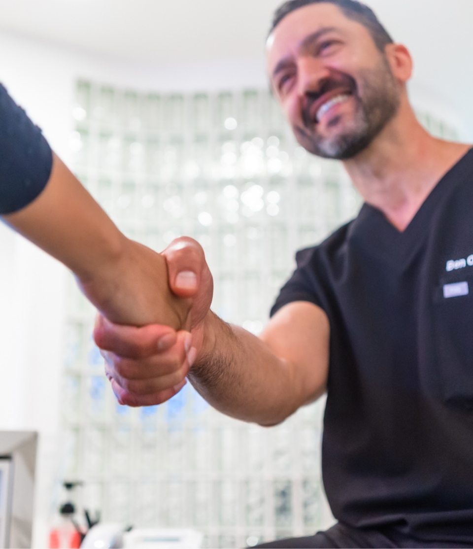 Dentist shaking hands with dental patient in San Juan Capistrano