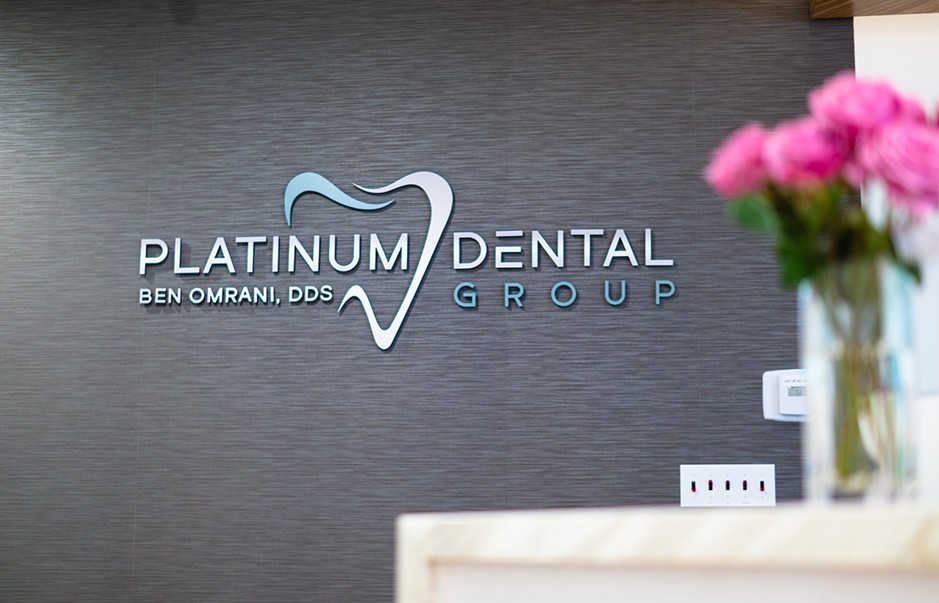 Platinum Dental Group of San Juan Capistrano sign on dental office wall