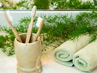 Toothbrushes in a clay cup