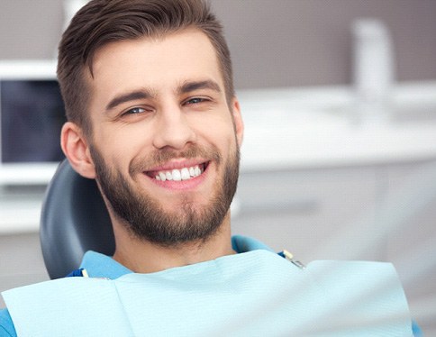 Man smiling during dental appointment