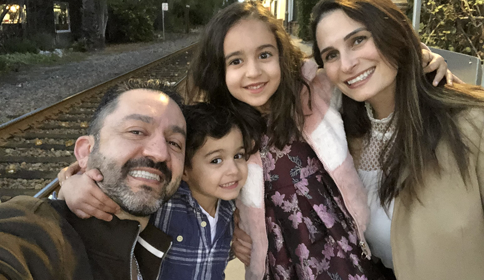 Doctor Omrani and his family outdoors