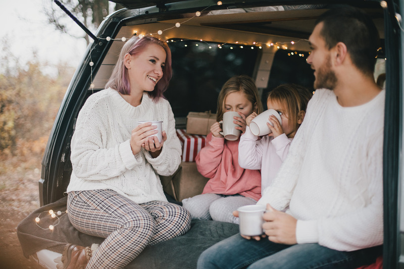 Patient smiling with family with Invisalign